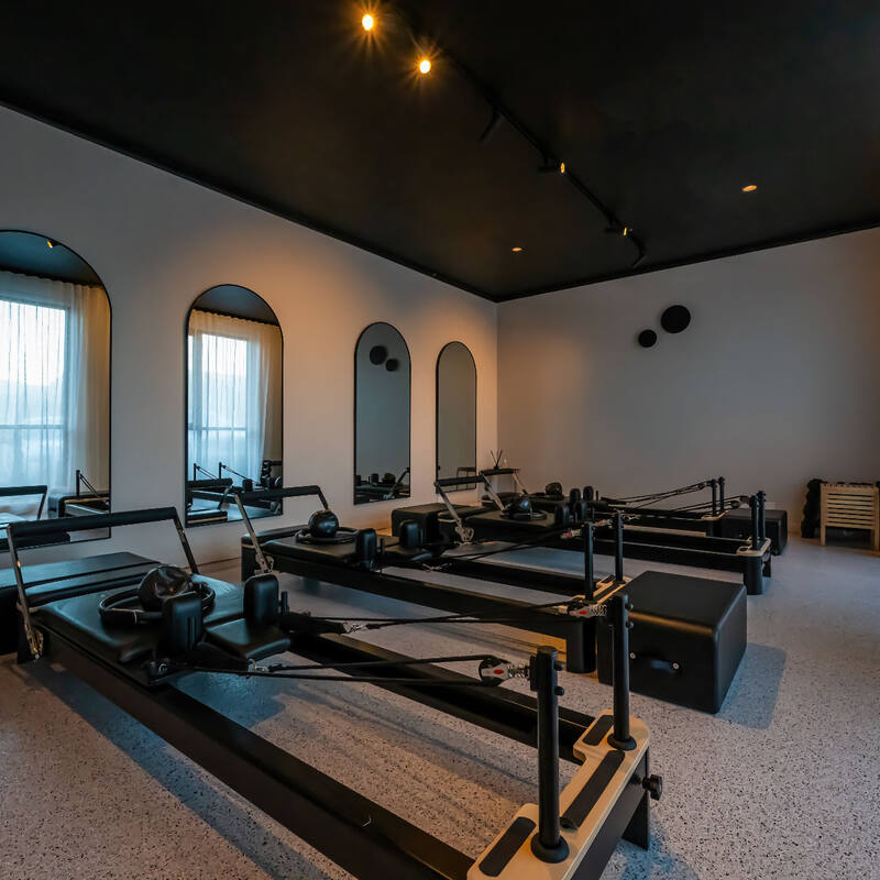 The bright TFS Reformer Pilates studio with arched windows